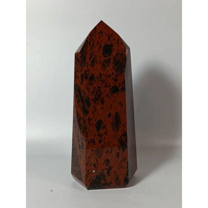 Hand-carved Mahogany Obsidian tower with rich brown and black swirls, displayed on a white background.