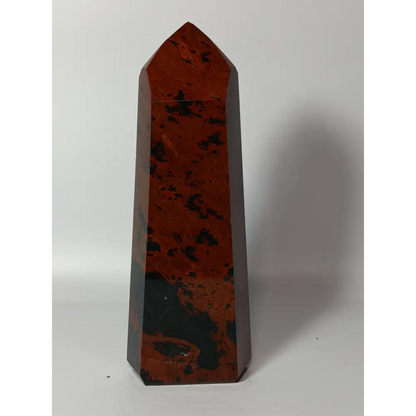 Hand-carved Mahogany Obsidian tower with rich brown and black swirls, displayed on a white background.