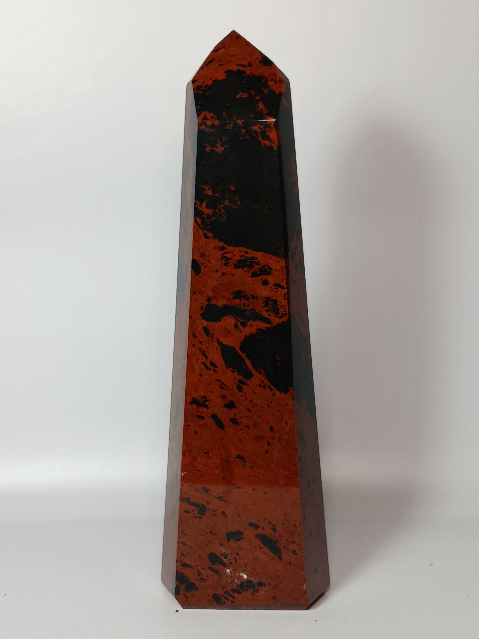 Hand-carved Mahogany Obsidian tower with rich brown and black swirls, displayed on a white background.