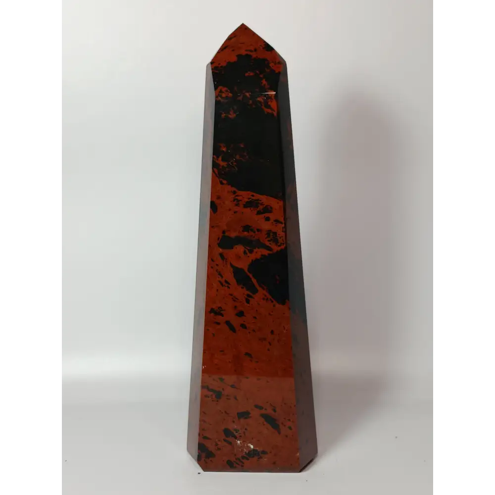 Hand-carved Mahogany Obsidian tower with rich brown and black swirls, displayed on a white background.