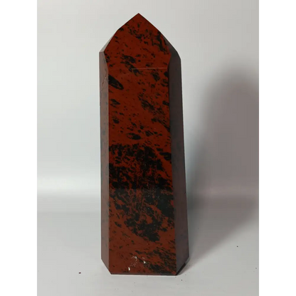 Hand-carved Mahogany Obsidian tower with rich brown and black swirls, displayed on a white background.