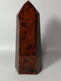 Hand-carved Mahogany Obsidian tower with rich brown and black swirls, displayed on a white background.