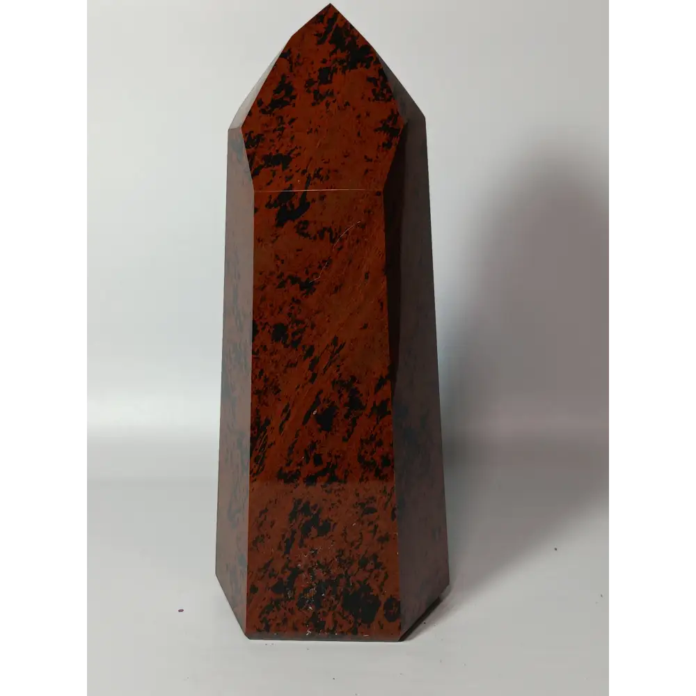 Hand-carved Mahogany Obsidian tower with rich brown and black swirls, displayed on a white background.
