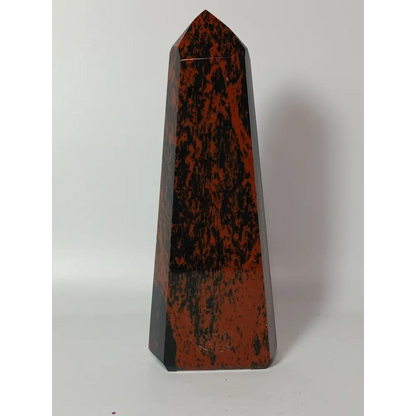 Hand-carved Mahogany Obsidian tower with rich brown and black swirls, displayed on a white background.