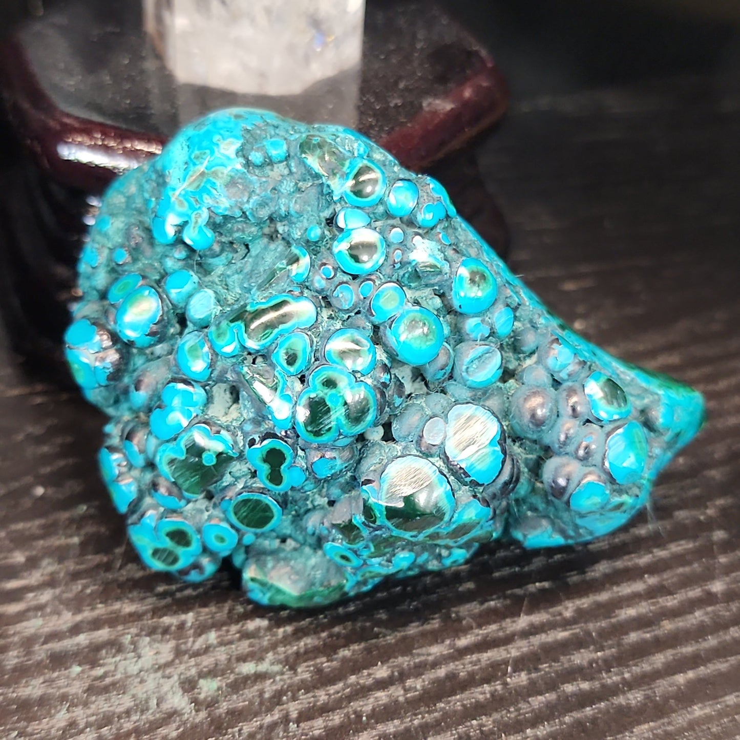 Malachite and chrysocolla specimen with vibrant green bands and blue-teal hues, displayed on a white background. Perfect for transformation, heart healing, and inner wisdom.