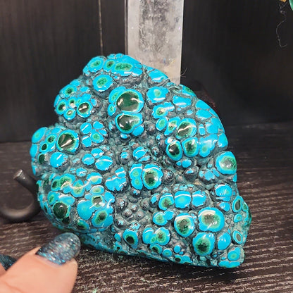 Malachite and chrysocolla specimen with vibrant green bands and blue-teal hues, displayed on a white background. Perfect for transformation, heart healing, and inner wisdom.