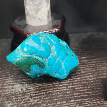 Malachite and chrysocolla specimen with vibrant green bands and blue-teal hues, displayed on a white background. Perfect for transformation, heart healing, and inner wisdom.