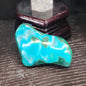 Malachite and chrysocolla specimen with vibrant green bands and blue-teal hues, displayed on a white background. Perfect for transformation, heart healing, and inner wisdom.