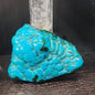 Malachite and chrysocolla specimen with vibrant green bands and blue-teal hues, displayed on a white background. Perfect for transformation, heart healing, and inner wisdom.