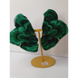 Pair of polished malachite slabs with vibrant green banding, displayed upright on a metal stand against a white background.