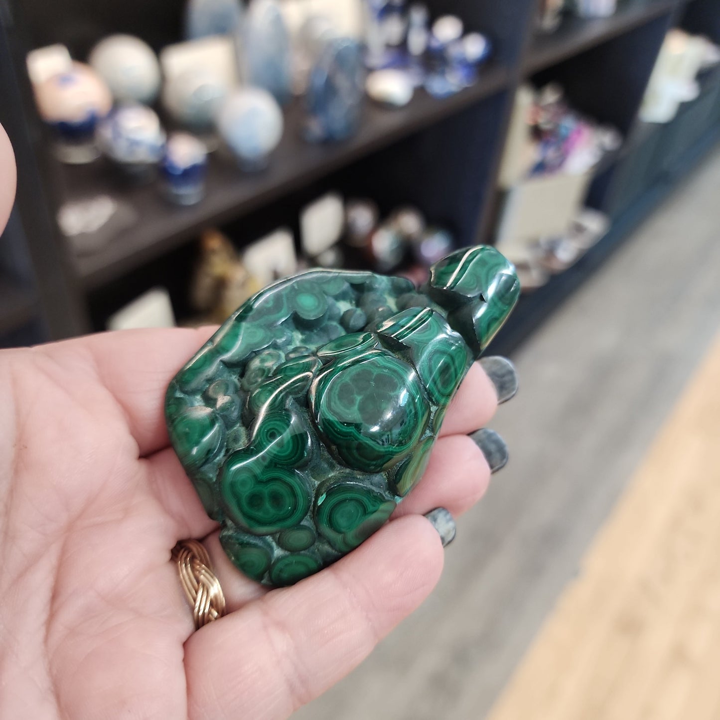 Hand-selected malachite specimen with vibrant green bands and natural patterns, displayed on a white background. Perfect for transformation, protection, and heart chakra healing.