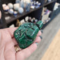 Hand-selected malachite specimen with vibrant green bands and natural patterns, displayed on a white background. Perfect for transformation, protection, and heart chakra healing.