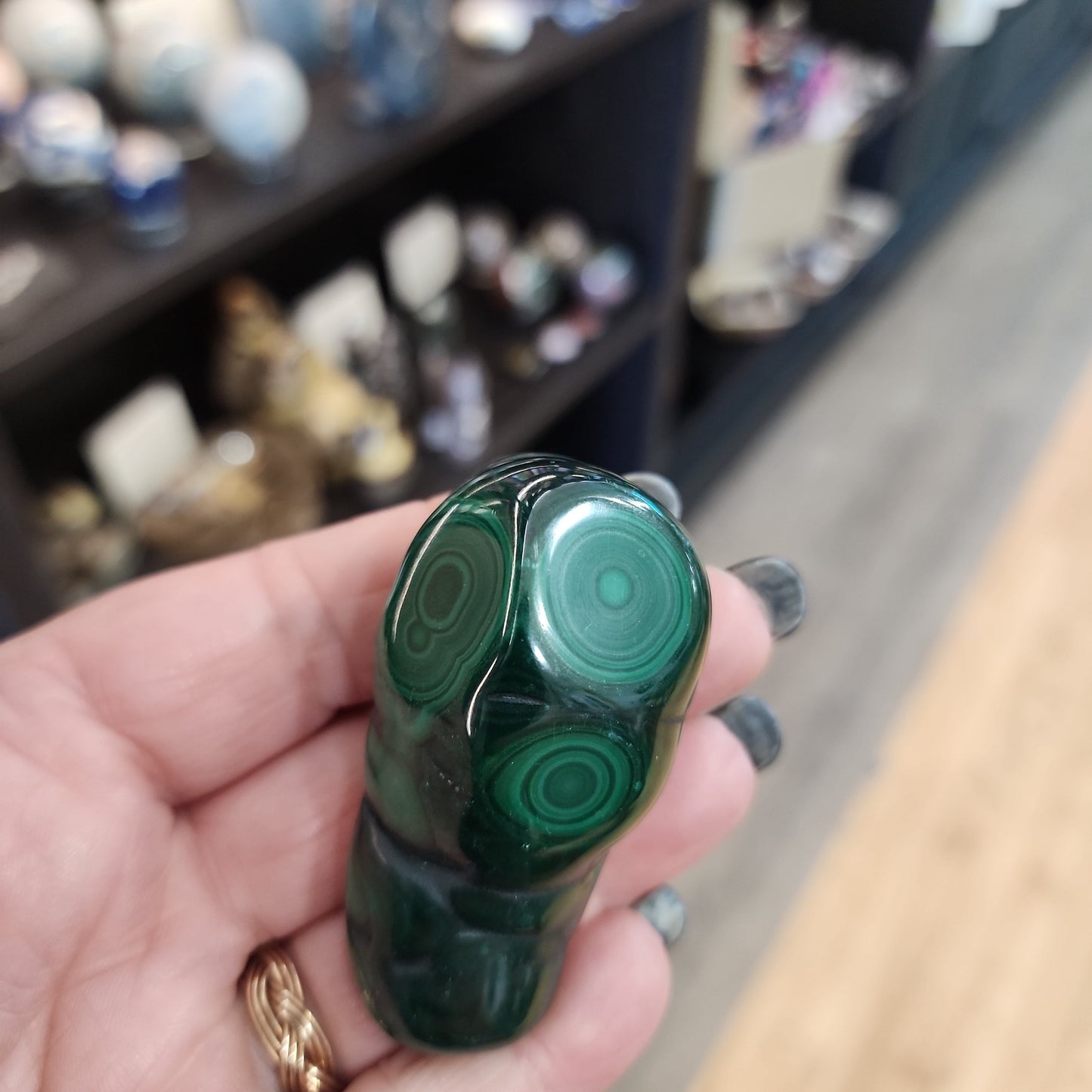 Hand-selected malachite specimen with vibrant green bands and natural patterns, displayed on a white background. Perfect for transformation, protection, and heart chakra healing.