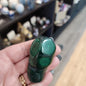 Hand-selected malachite specimen with vibrant green bands and natural patterns, displayed on a white background. Perfect for transformation, protection, and heart chakra healing.