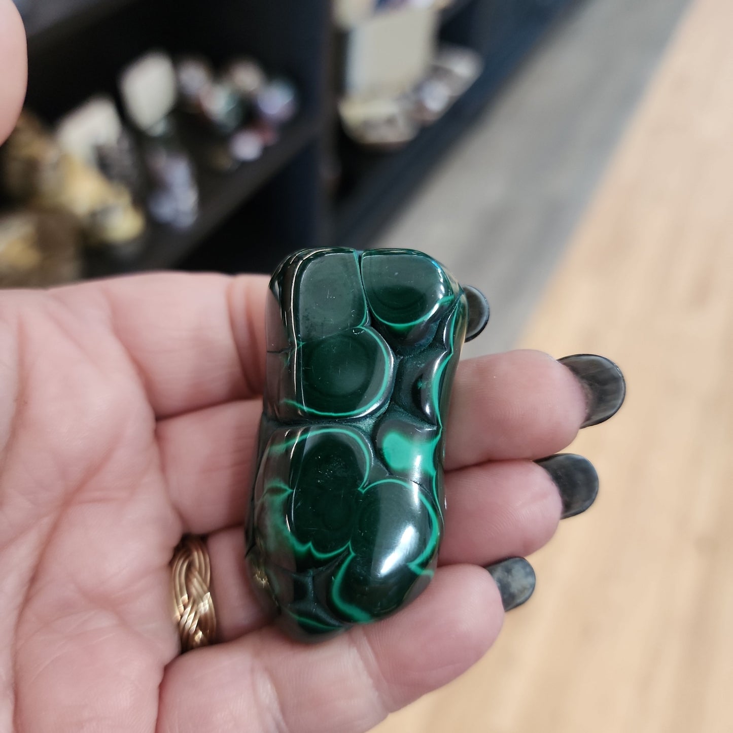 Hand-selected malachite specimen with vibrant green bands and natural patterns, displayed on a white background. Perfect for transformation, protection, and heart chakra healing.