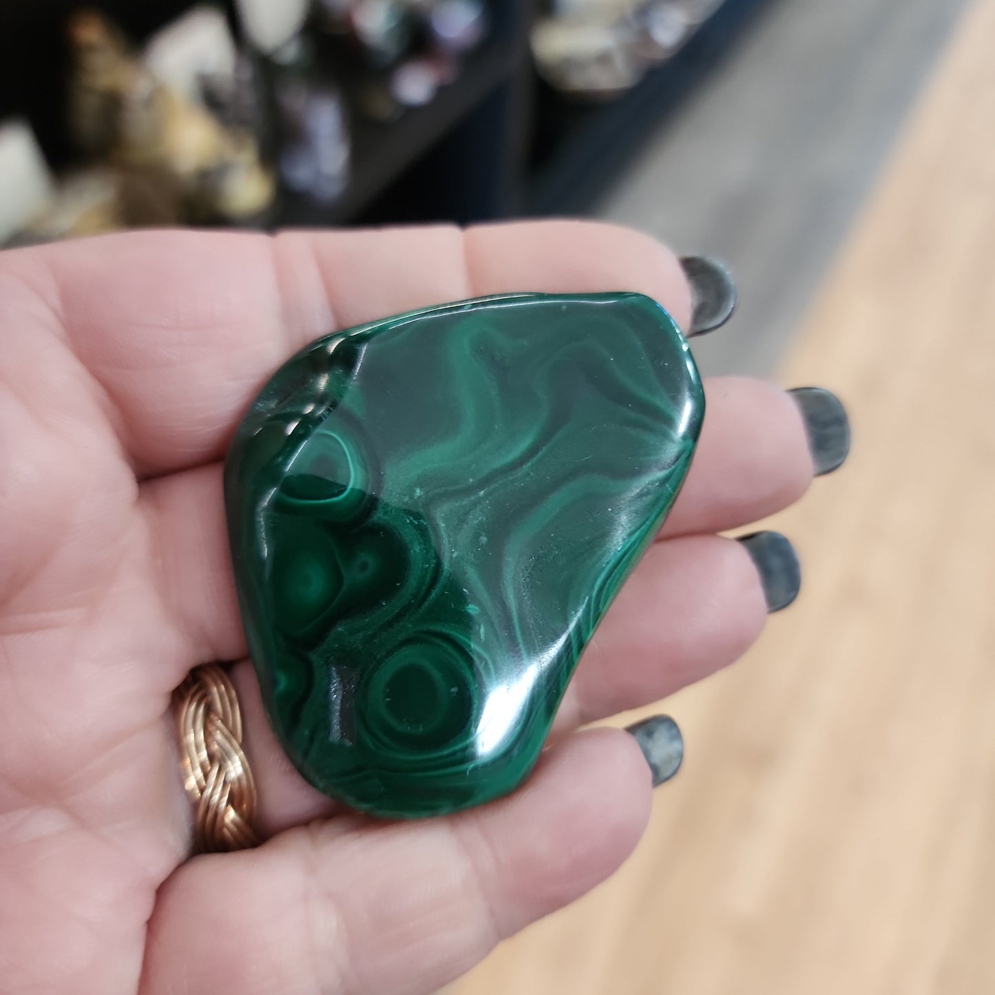 Hand-selected malachite specimen with vibrant green bands and natural patterns, displayed on a white background. Perfect for transformation, protection, and heart chakra healing.