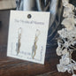 Sterling silver medium feather earrings with delicate detailing, displayed on a white background. Perfect for spiritual freedom, guidance, and everyday magic.