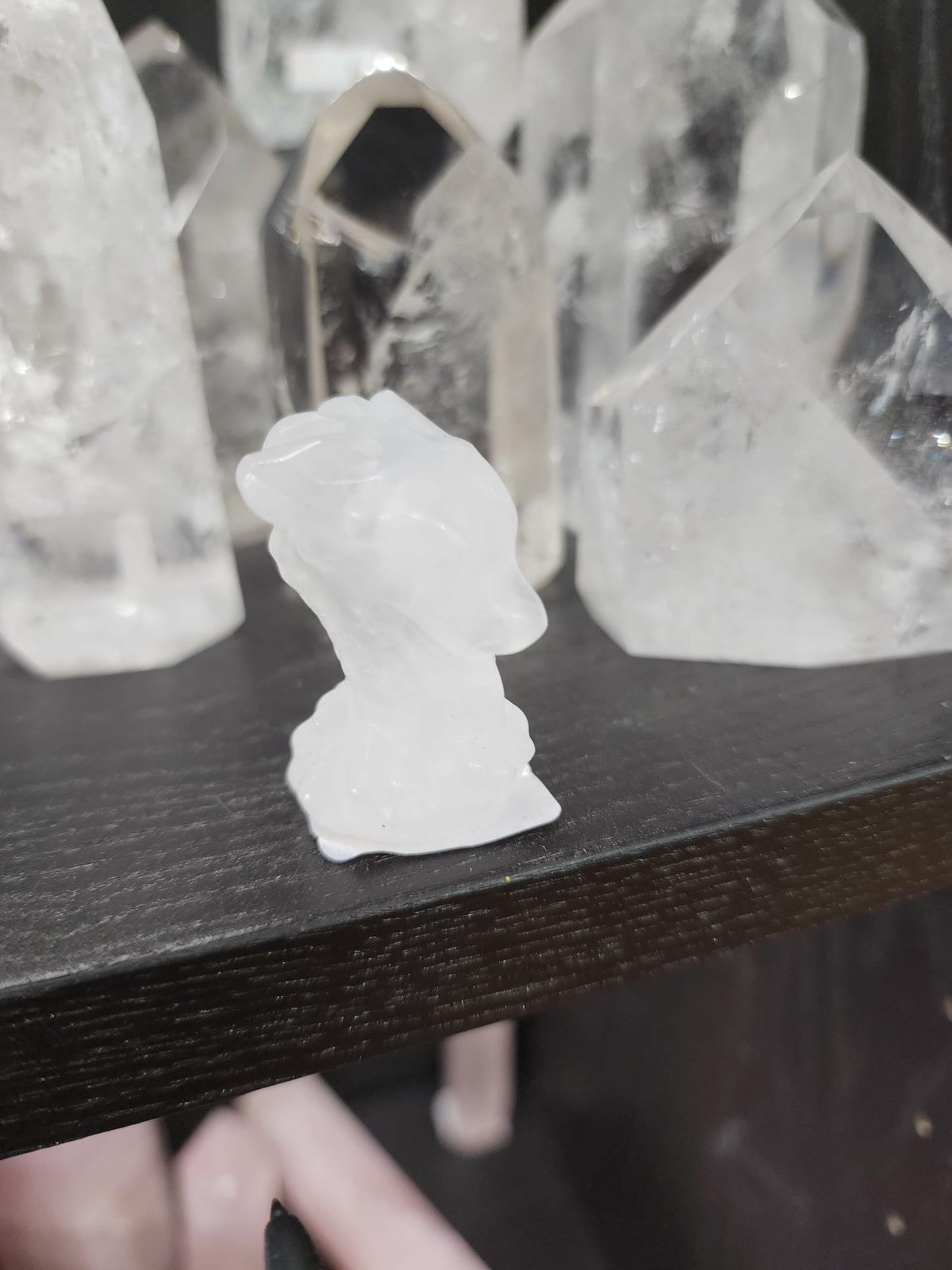 Hand-carved assorted crystal dragon heads, each 1 3/4 inches in size, featuring various colors and natural stone patterns, displayed on a white background. Perfect for power, wisdom, and magical protection.