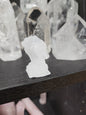 Hand-carved assorted crystal dragon heads, each 1 3/4 inches in size, featuring various colors and natural stone patterns, displayed on a white background. Perfect for power, wisdom, and magical protection.