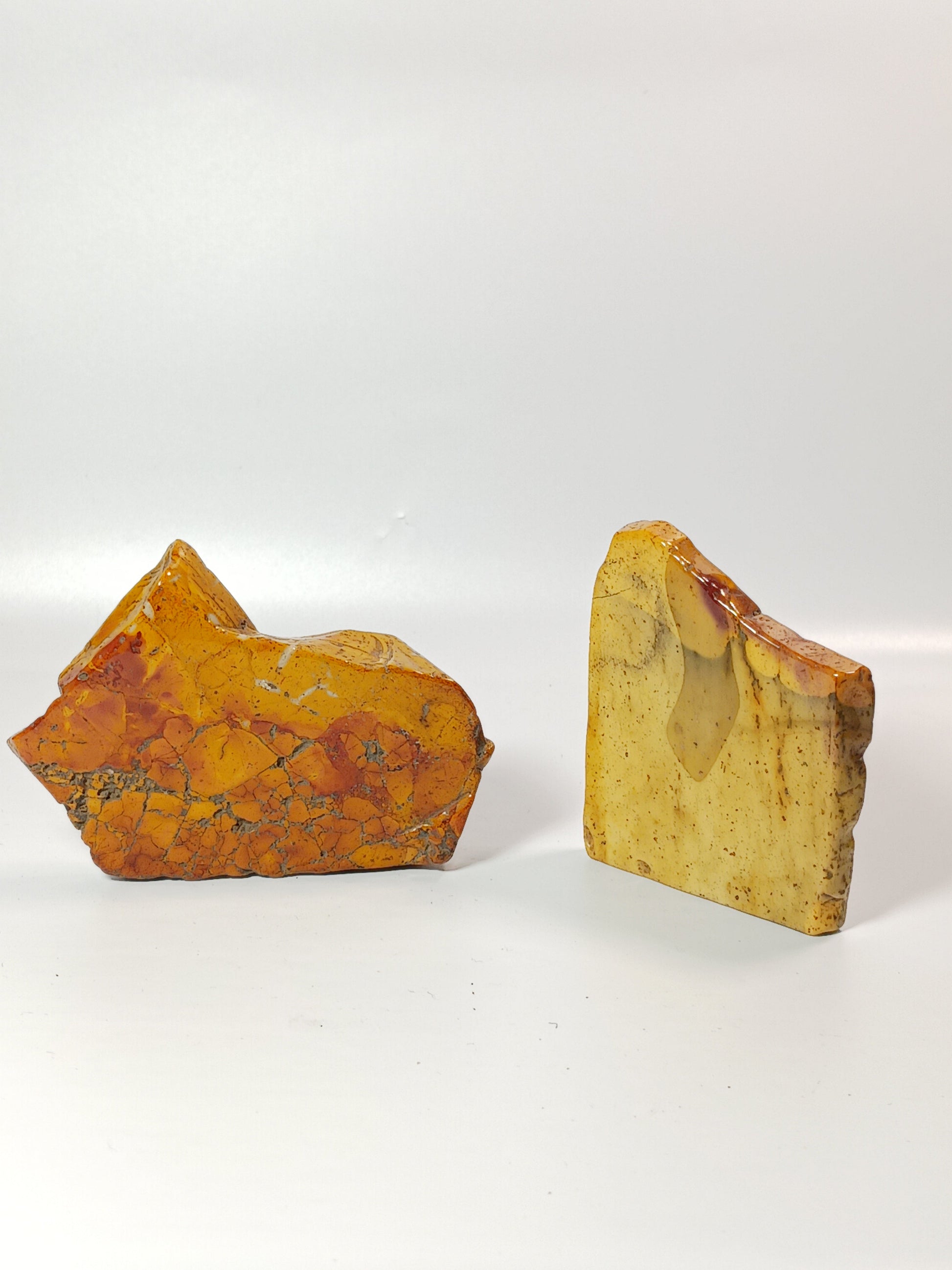 Hand-polished Mookaite slab, 2–2.5 inches, with vibrant red, yellow, and cream patterns, displayed on a white background.