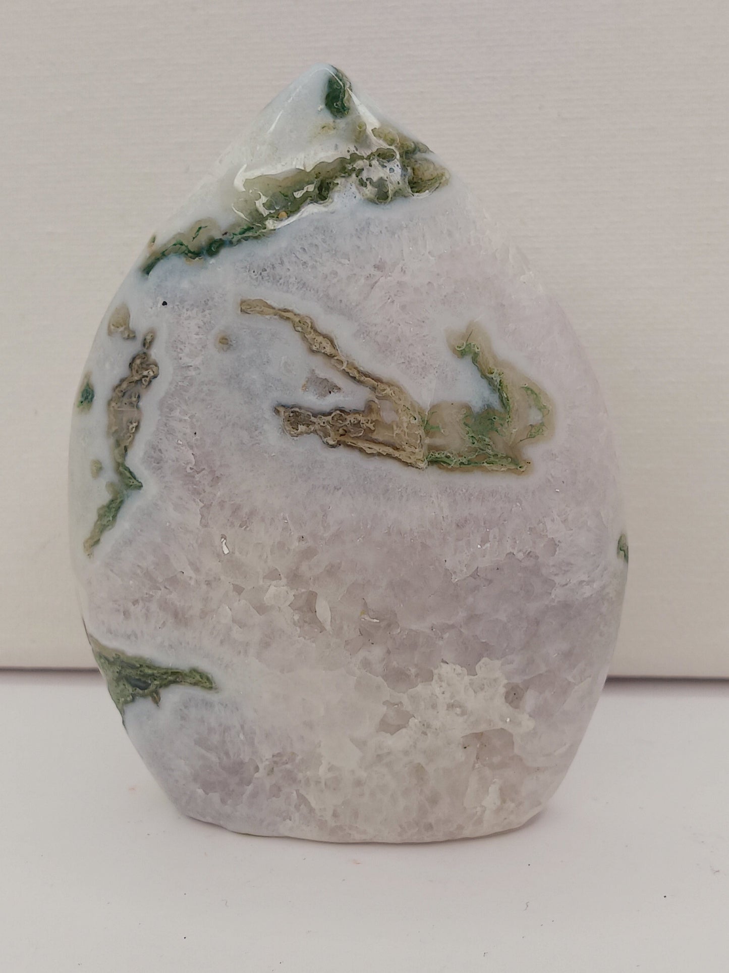 Moss Agate freeform, approx. 4 inches tall, with lush green and white patterns, displayed on a white background.