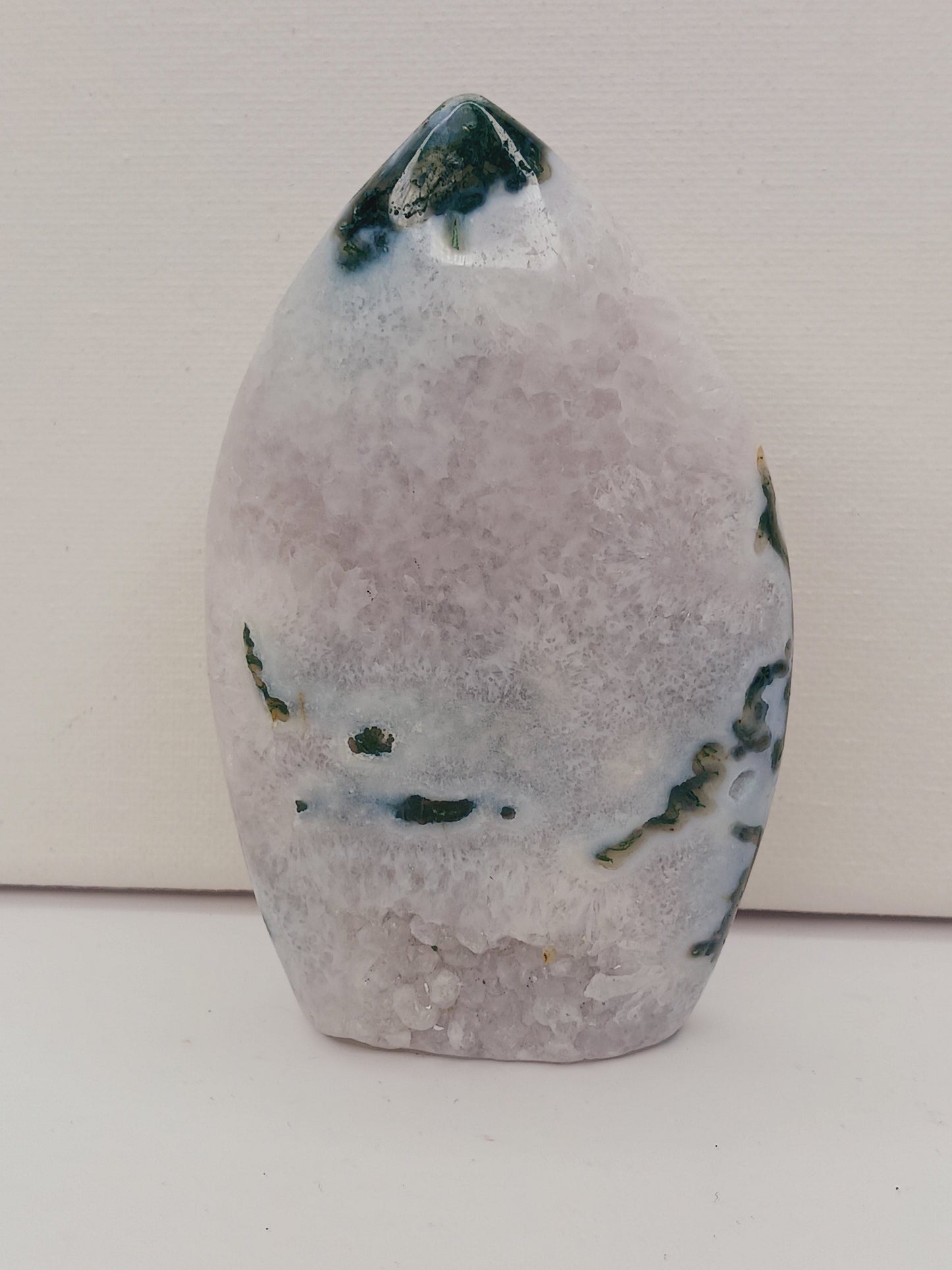 Moss Agate freeform, approx. 4 inches tall, with lush green and white patterns, displayed on a white background.