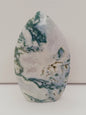 Moss Agate freeform, approx. 4 inches tall, with lush green and white patterns, displayed on a white background.