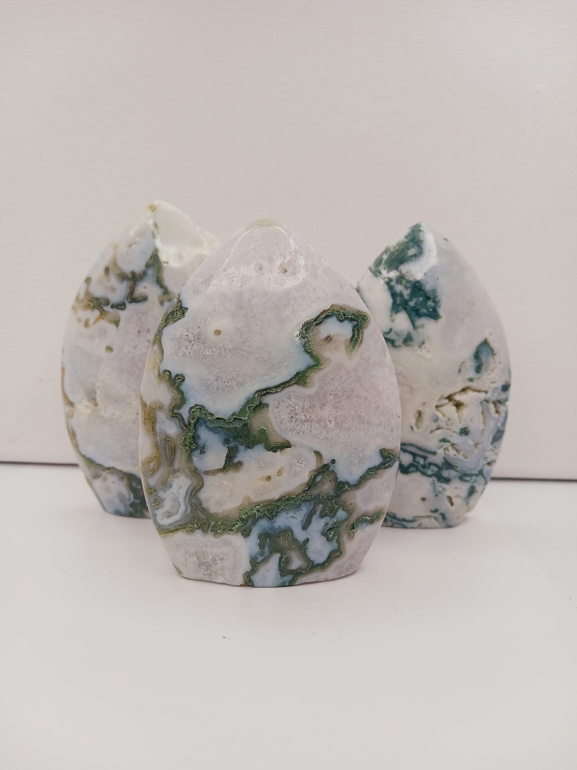 Moss Agate freeform, approx. 4 inches tall, with lush green and white patterns, displayed on a white background.