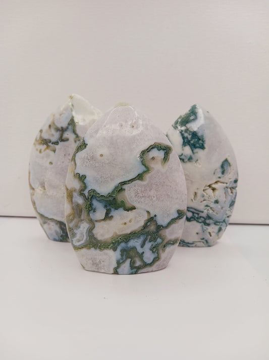 Moss Agate freeform, approx. 4 inches tall, with lush green and white patterns, displayed on a white background.