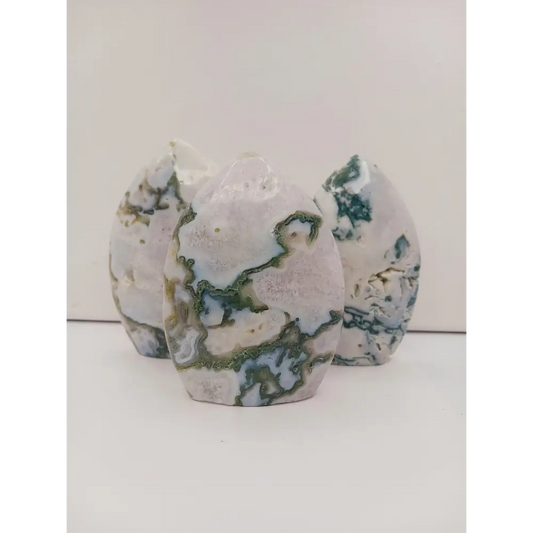 Moss Agate freeform, approx. 4 inches tall, with lush green and white patterns, displayed on a white background.