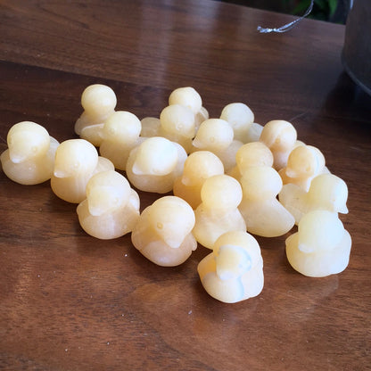 Hand-carved orange calcite mini duck with vibrant orange hues, displayed on a white background. Perfect for joy, playfulness, and creative energy.