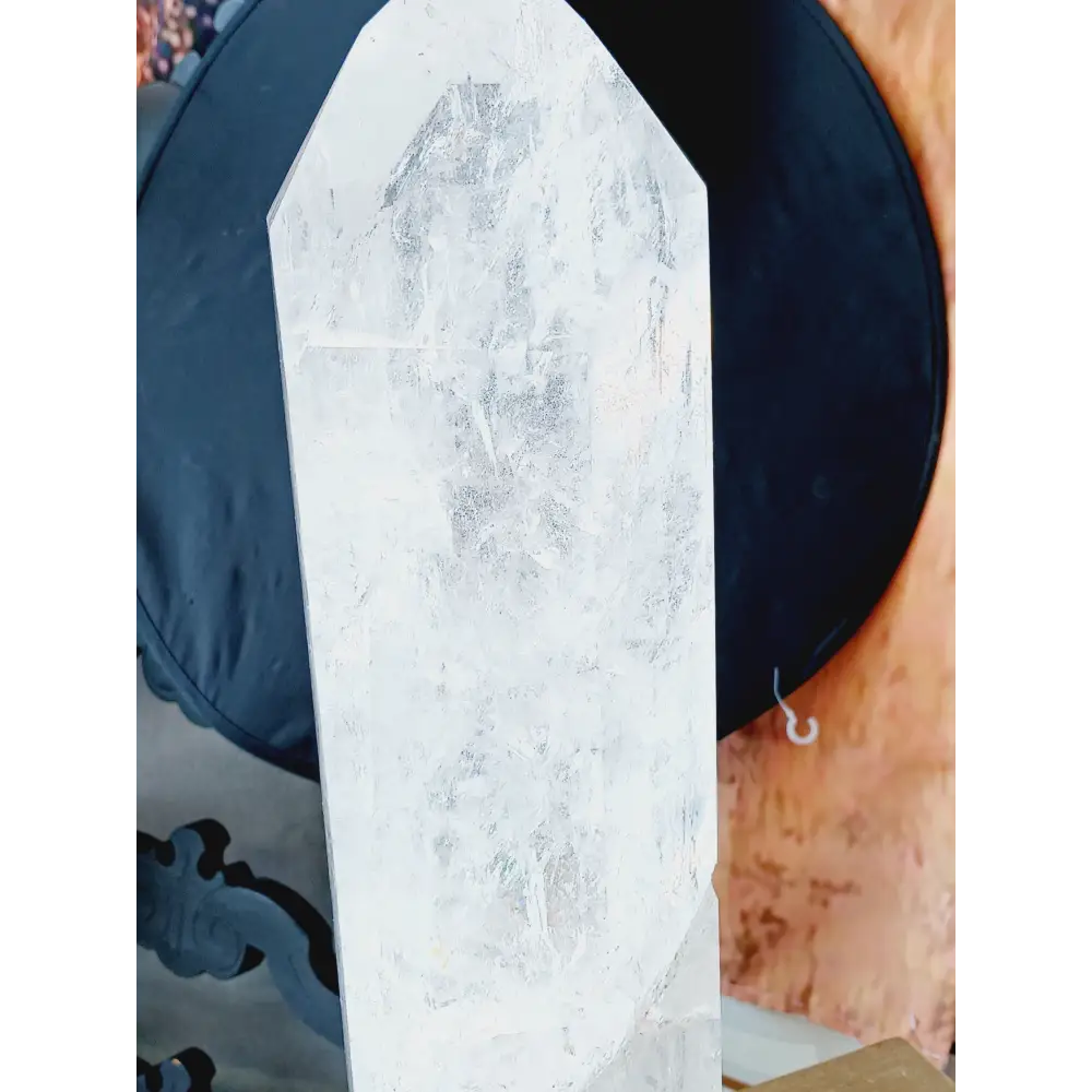 Diamantina clear quartz tower, 17 inches tall, polished with exceptional clarity and natural inclusions, displayed on a white background.