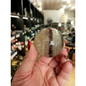 Hand-polished Rainbow and Clear Fluorite sphere featuring luminous bands of purple, green, blue, and clear tones, displayed on a white background.
