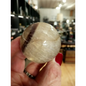 Hand-polished Rainbow and Clear Fluorite sphere featuring luminous bands of purple, green, blue, and clear tones, displayed on a white background.