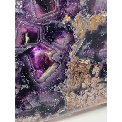 Rainbow fluorite bowl, 7.5 inches, with vibrant bands of color and a garden-like pattern on the back, displayed on a white background.