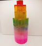 Rainbow selenite tiered tower, polished with a vibrant rainbow sheen and step-like design, displayed on a white background.