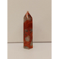 Hand-carved Red Jasper point with a clear quartz band, featuring vibrant red tones and a striking clear quartz stripe, displayed on a white background.