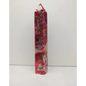Polished red and white crystal wand on a white background