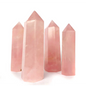 Hand-polished Rose Quartz tower featuring vibrant, translucent pink hues, displayed on a white background.