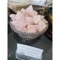 Raw rose quartz crystal with soft pink hues and natural, rough texture, displayed on a white background. Perfect for heart healing, love, and emotional balance.