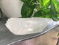 Natural rough quartz point crystal with clear, unpolished surfaces and unique shape, displayed on a white background. Perfect for energy amplification, cleansing, and spiritual work.