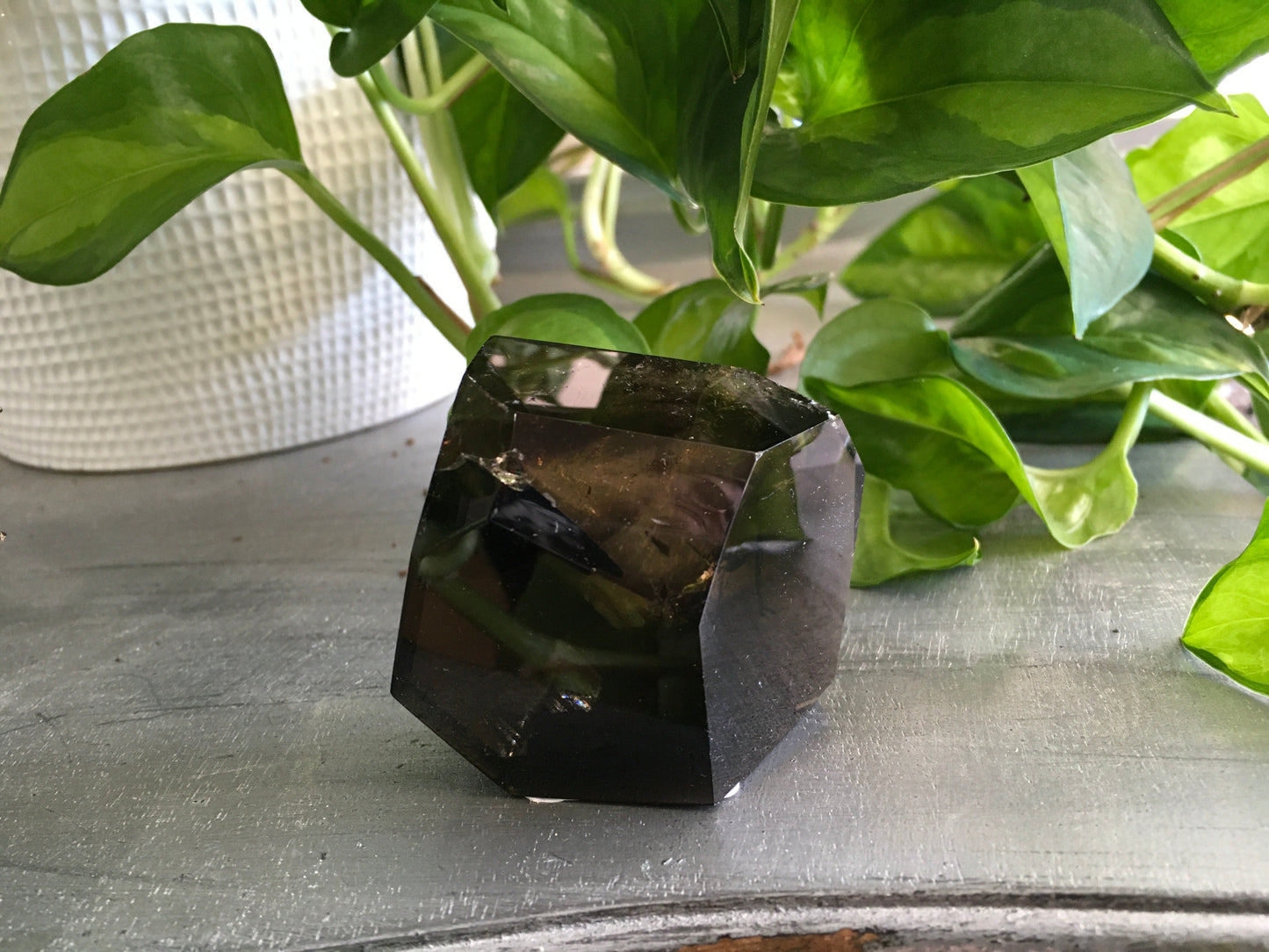 Smokey Quartz Free Form crystal with natural smoky brown tones, polished and uniquely shaped, displayed on a white background. Perfect for grounding, protection, and energy work.