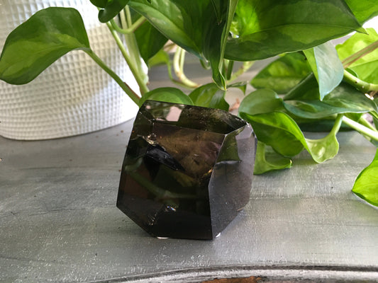 Smokey Quartz Free Form crystal with natural smoky brown tones, polished and uniquely shaped, displayed on a white background. Perfect for grounding, protection, and energy work.
