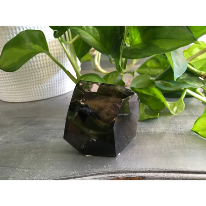 Smokey Quartz Free Form crystal with natural smoky brown tones, polished and uniquely shaped, displayed on a white background. Perfect for grounding, protection, and energy work.