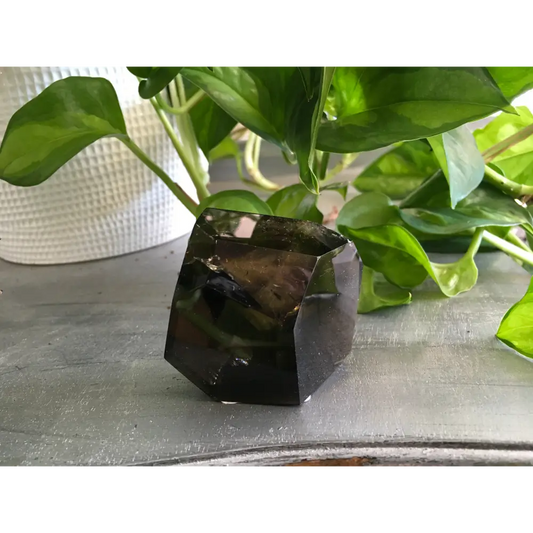 Smokey Quartz Free Form crystal with natural smoky brown tones, polished and uniquely shaped, displayed on a white background. Perfect for grounding, protection, and energy work.
