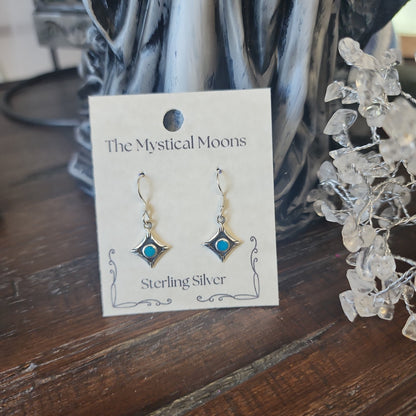 Sterling silver square earrings featuring vibrant turquoise stones, displayed on a white background. Perfect for protection, wisdom, and Southwestern style.