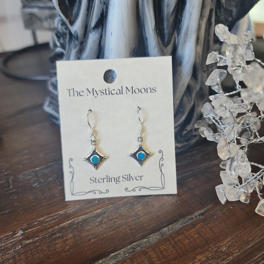 Sterling silver square earrings featuring vibrant turquoise stones, displayed on a white background. Perfect for protection, wisdom, and Southwestern style.