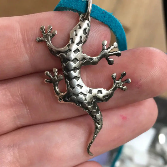 Sterling silver lizard pendant with intricate detailing, displayed on a white background. Perfect for transformation, adaptability, and ancient wisdom.