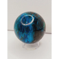 Turquoise sphere with vibrant blue-green color and natural veining, displayed on a white background.