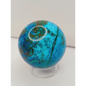 Turquoise sphere with vibrant blue-green color and natural veining, displayed on a white background.